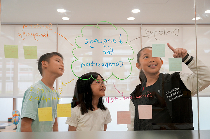 Eton Academy students brainstorming together